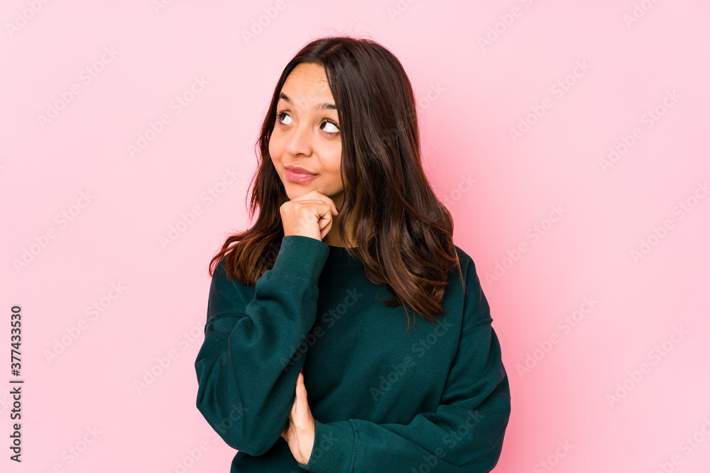 Young mixed race hispanic woman isolated looking sideways with doubtful and skeptical expression. Young mixed race hispanic woman isolated looking sideways with doubtful and skeptical expression.