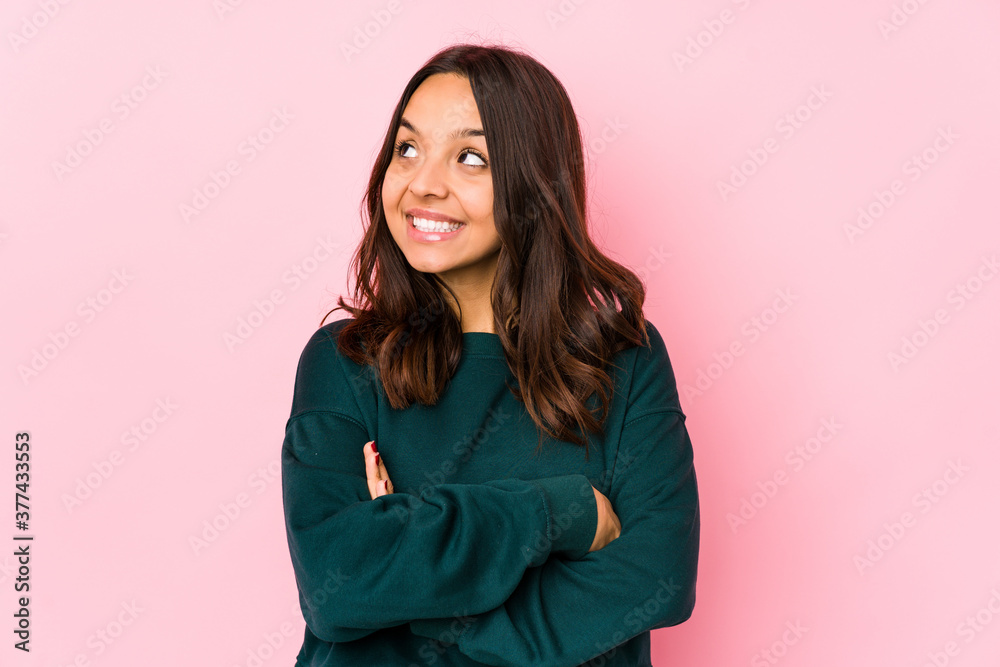 Fototapeta premium Young mixed race hispanic woman isolated smiling confident with crossed arms.