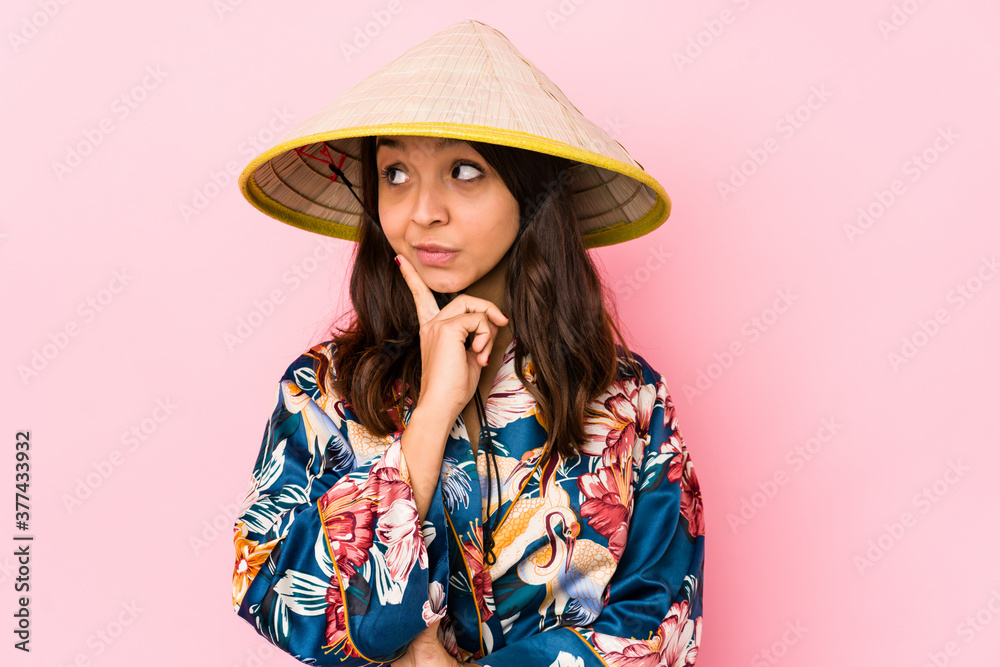 Young mixed race hispanic woman isolated looking sideways with doubtful and skeptical expression. Young mixed race hispanic woman isolated looking sideways with doubtful and skeptical expression.