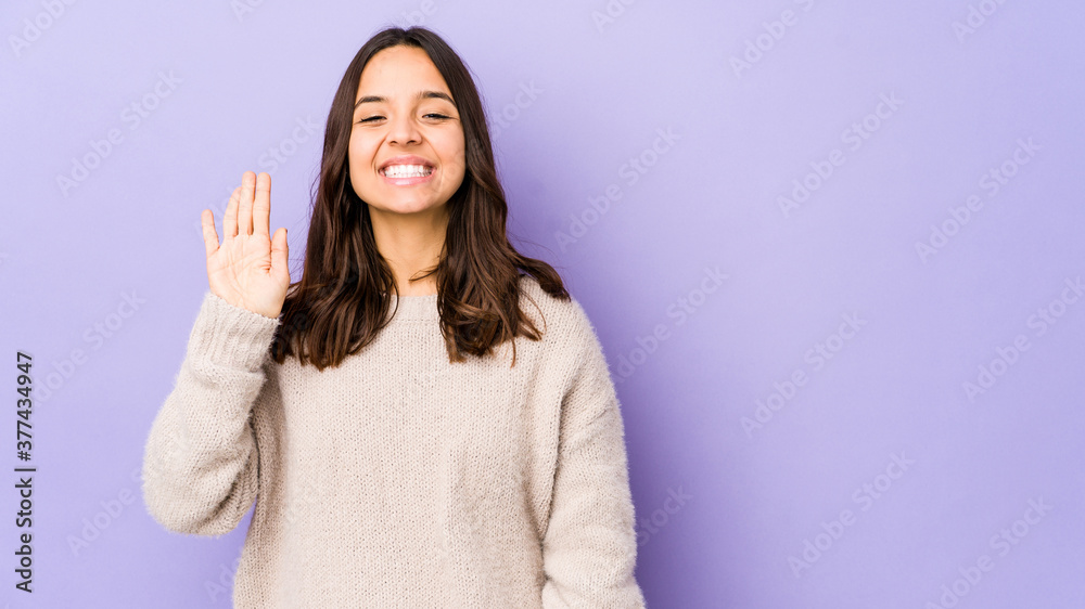 Young mixed race hispanic woman isolated smiling cheerful showing number five with fingers. Young mixed race hispanic woman isolated smiling cheerful showing number five with fingers.