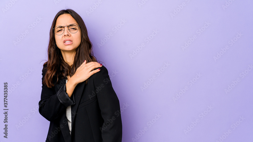 Young mixed race hispanic woman isolated having a shoulder pain. Young mixed race hispanic woman isolated having a shoulder pain.