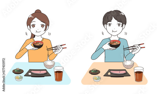 ご飯を頬張る　左利き