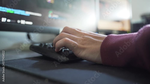 Gamer's Hand, while Playing fps game in his Room