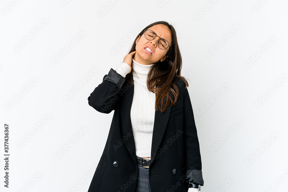 Young mixed race business woman isolated on white background having a neck pain due to stress, massaging and touching it with hand. Young mixed race business woman isolated on white background having a neck pain due to stress, massaging and touching it with hand.
