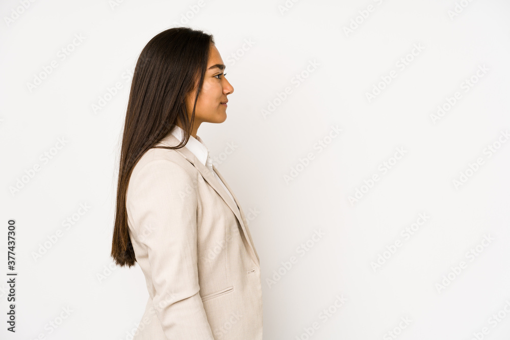 Young woman isolated on a white background gazing left, sideways pose. Young woman isolated on a white background gazing left, sideways pose.