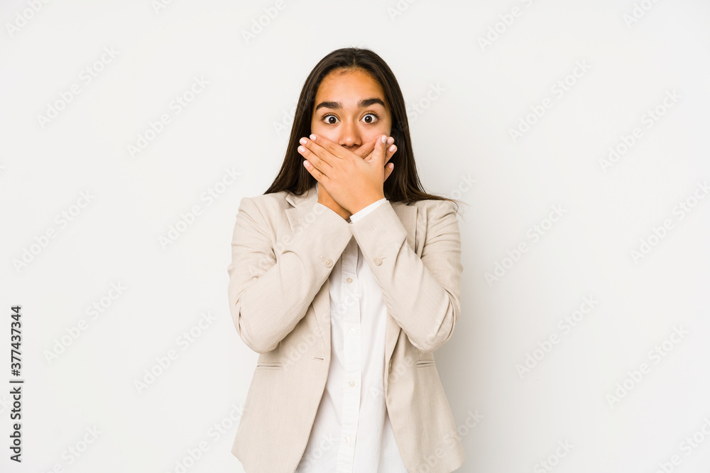 Young woman isolated on a white background shocked covering mouth with hands. Young woman isolated on a white background shocked covering mouth with hands.