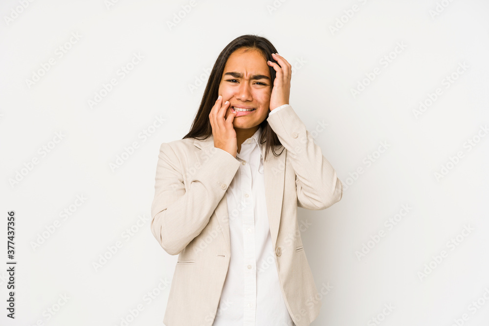 Young woman isolated on a white background whining and crying disconsolately. Young woman isolated on a white background whining and crying disconsolately.