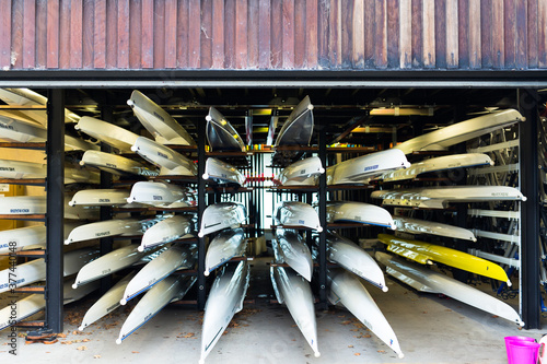 Rowing boats stacked in a boat house photo