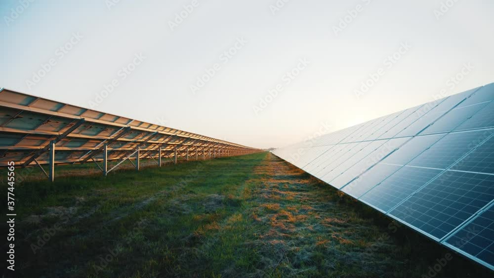 Rows of solar array installed on ecological farmland field outdoor ...