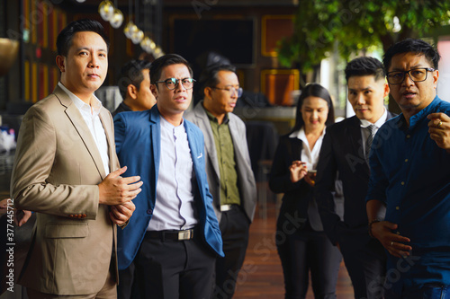 group of asian businessman in business suit standing together