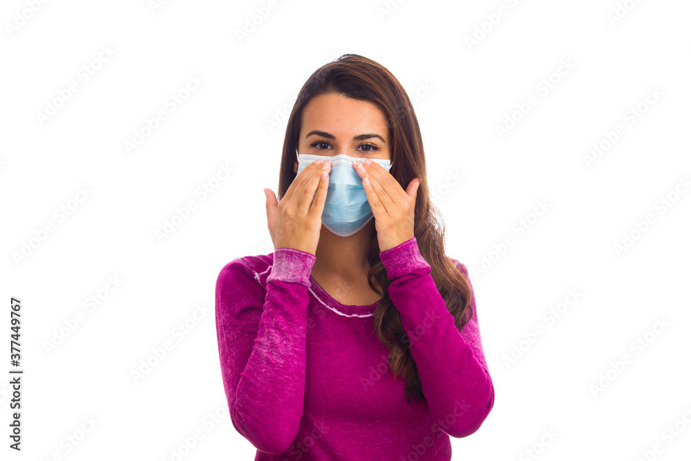 Beautiful young woman wearing a protective mask isolated on a white background Beautiful young woman wearing a protective mask isolated on a white background