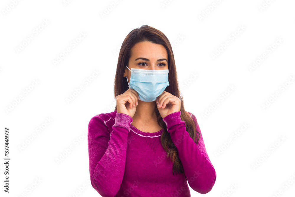 Beautiful young woman wearing a protective mask isolated on a white background Beautiful young woman wearing a protective mask isolated on a white background