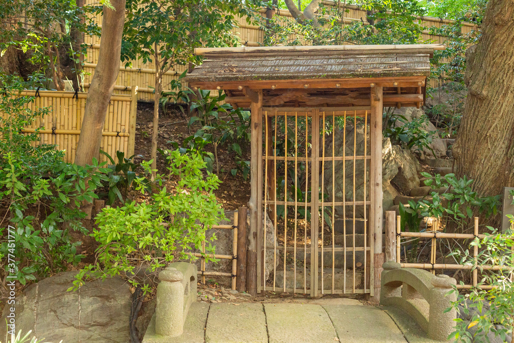 small wooden traditional gate in japanese garden in tokyo, japan small wooden traditional gate in japanese garden in tokyo, japan