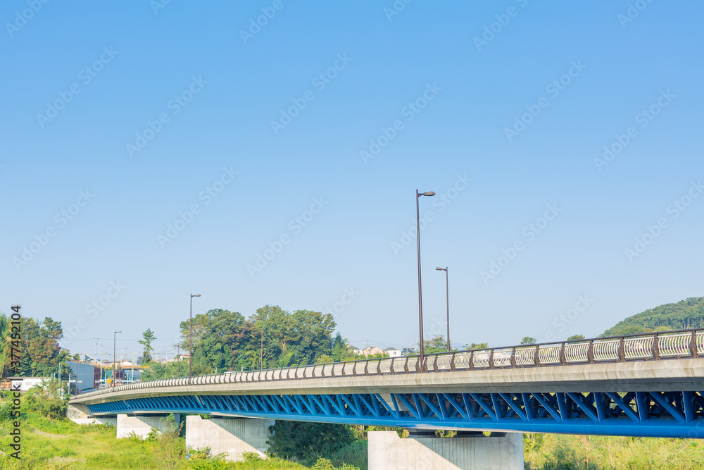 scenery of blue sky and bridge over the river in countryside in tokyo, japan