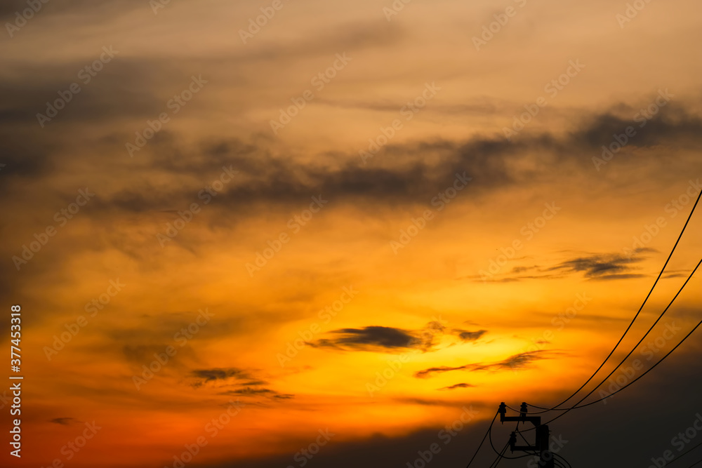 Orange sky with clouds, Electric wire silhouette Orange sky with clouds, Electric wire silhouette