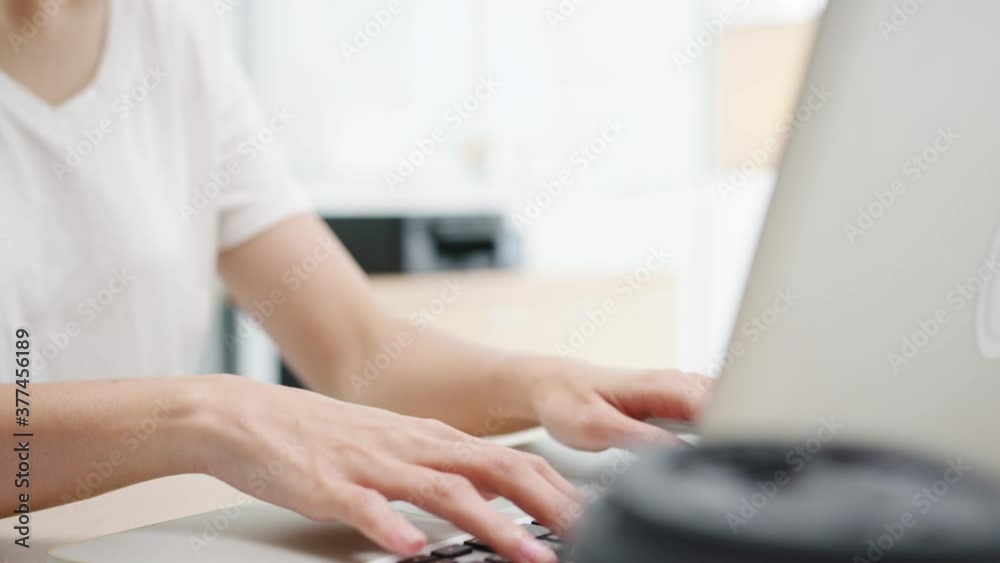 Freelance young Asia businesswoman casual wear using laptop working in living room at home. Working from home, remotely work, self isolation, social distancing, quarantine for corona virus prevention. Freelance young Asia businesswoman casual wear using laptop working in living room at home. Working from home, remotely work, self isolation, social distancing, quarantine for corona virus prevention.