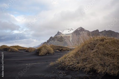 Snowcapped tops of Vestarahorn mountain and black sand beach in Stokksnes, Iceland