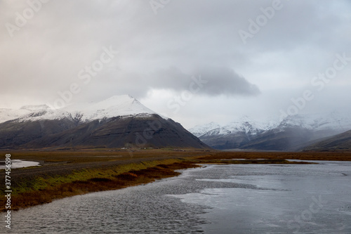 Billede på lærred clouds over the snowy mountains in iceland