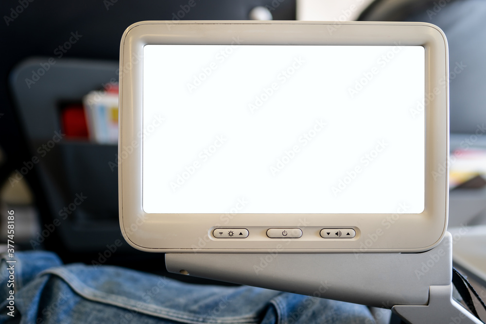 Screen in airplane, blank white display mockup in-flight. Screen in airplane, blank white display mockup in-flight.