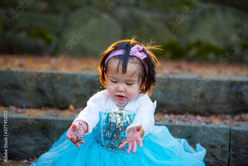 girl in the autumn park on blue dress