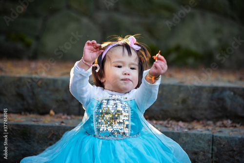 girl in the autumn park on blue dress
