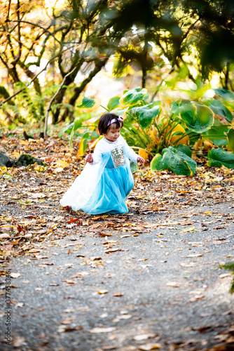 girl in the autumn park on blue dress