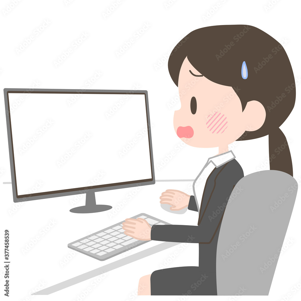PCに苦戦するスーツの女性 PCに苦戦するスーツの女性