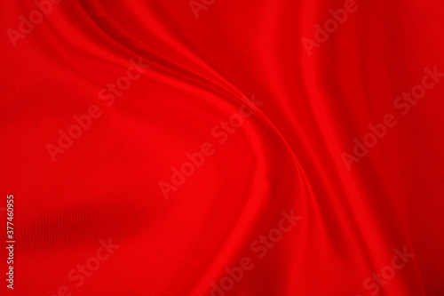 Smooth elegant red silk or satin luxury cloth texture background