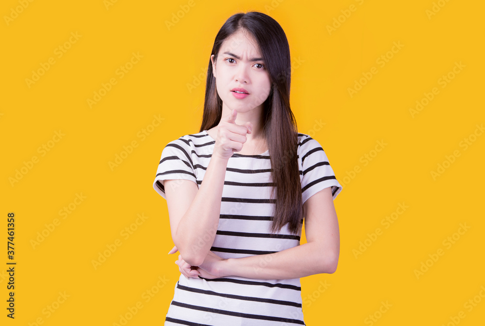 Portrait of beautiful asian young woman, on yellow color background with copy space. Human face expressions, emotions feelings, body language,beauty and fashion concept. Portrait of beautiful asian young woman, on yellow color background with copy space. Human face expressions, emotions feelings, body language,beauty and fashion concept.
