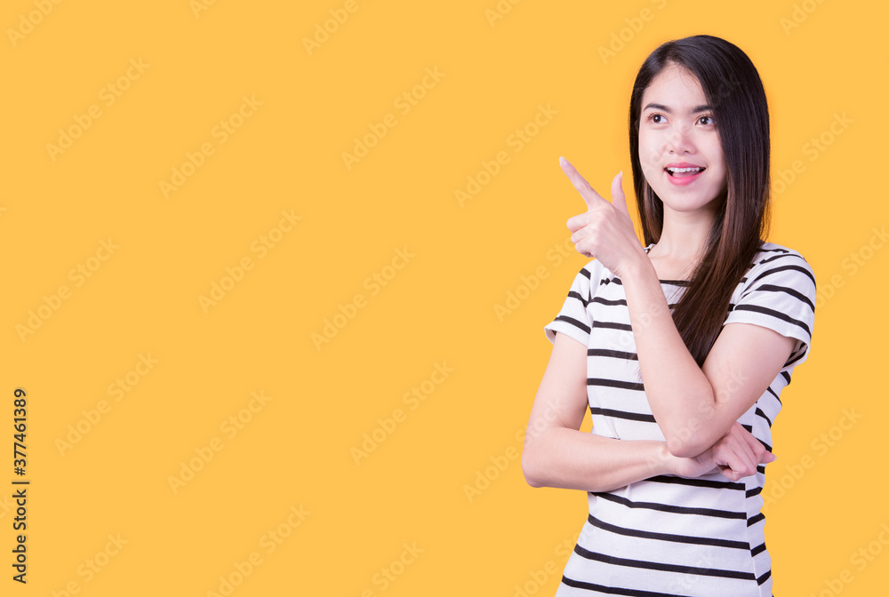 Portrait of beautiful asian young woman, on yellow color background with copy space. Human face expressions, emotions feelings, body language,beauty and fashion concept. Portrait of beautiful asian young woman, on yellow color background with copy space. Human face expressions, emotions feelings, body language,beauty and fashion concept.