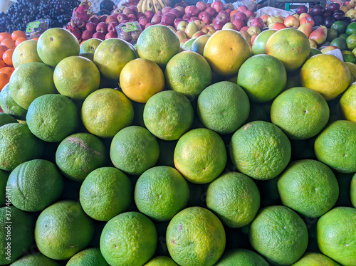 closeup view of green sweet lime (mosambi)in a local market photo