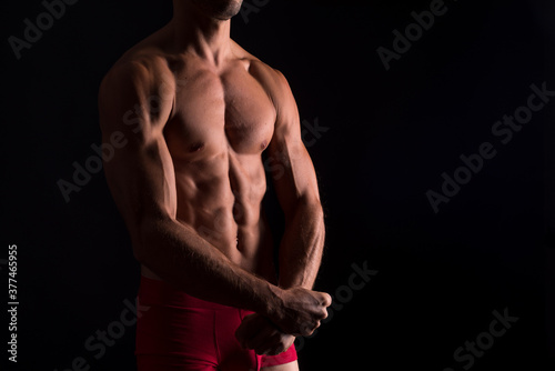 Muscular trunk of man in tension.