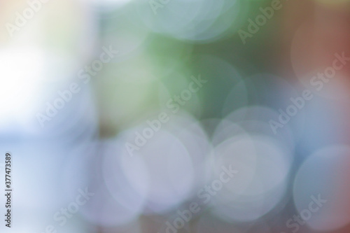 White bokeh on colorful background, abstract photo