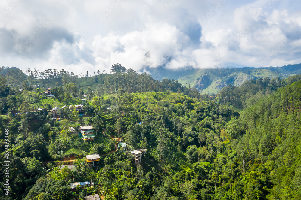 Fototapeta premium Aerial view of the houses in the mountains in the vicinity of Ella on the island of Sri Lanka