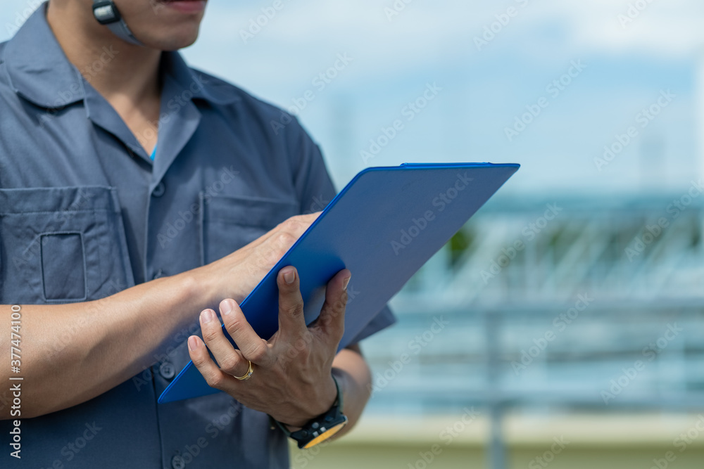 Man holding file with blur background, business concept
