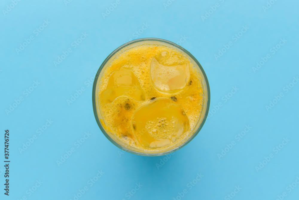Chia seeds lemonade. Refreshing summer beverage in a glass. Yellow drink with ice.