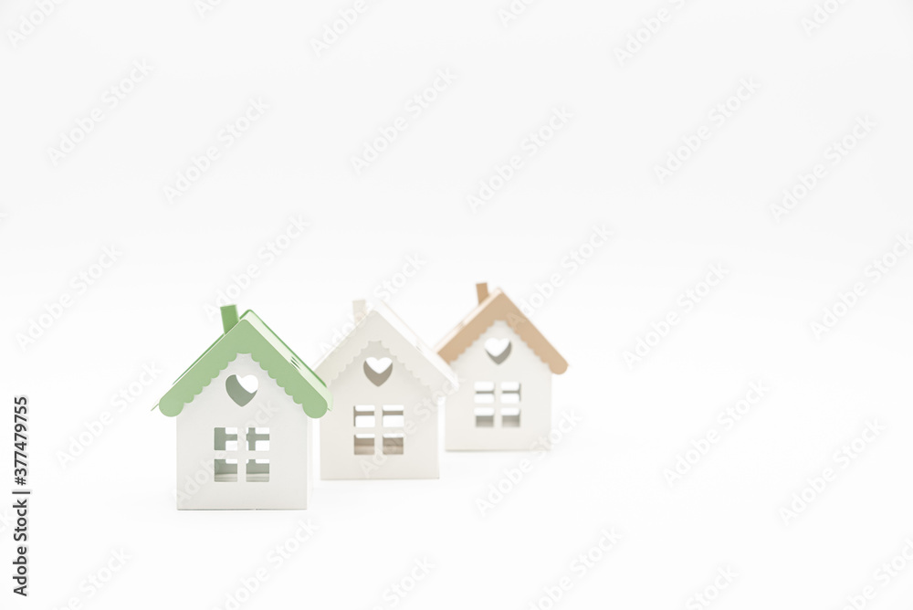 Small conceptual houses isolated on white background with plenty of copy space. Concept of home. Real Estate concept. Small conceptual houses isolated on white background with plenty of copy space. Concept of home. Real Estate concept.