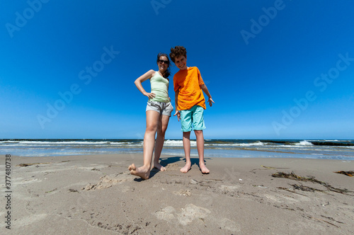 Teenage girl and boy on beach
