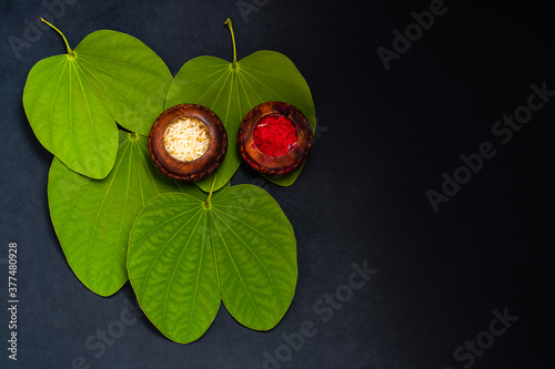 Indian Festival Dussehra , green leaf and rice photo