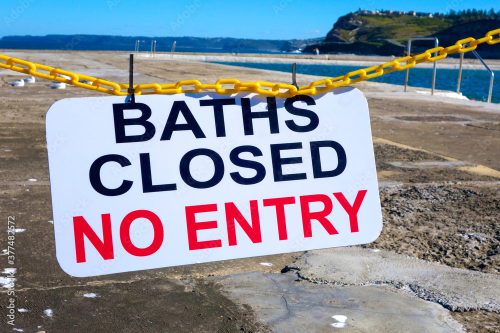 Baths closed no entry sign at the salt water baths, Newcastle, NSW