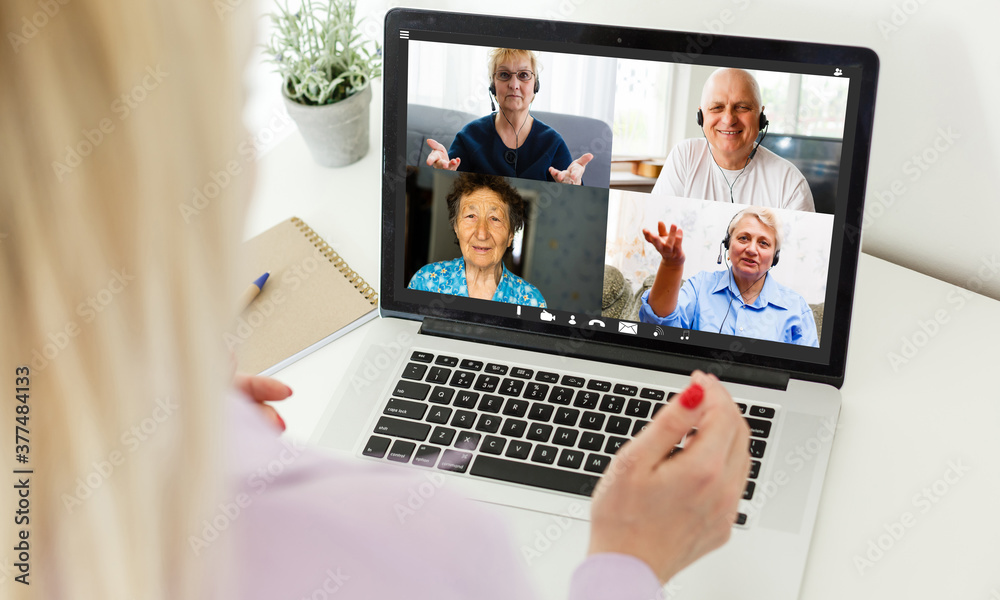 Multiethnic business team having discussion in video call. Rear view of business woman in video conference with boss and his colleagues during online meeting. Senior woman in video call with partners. Multiethnic business team having discussion in video call. Rear view of business woman in video conference with boss and his colleagues during online meeting. Senior woman in video call with partners.