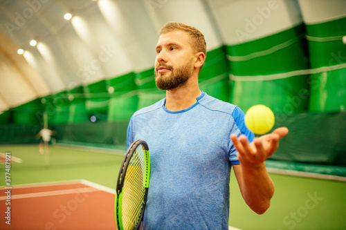 Professional tennis traner player playing a game photo