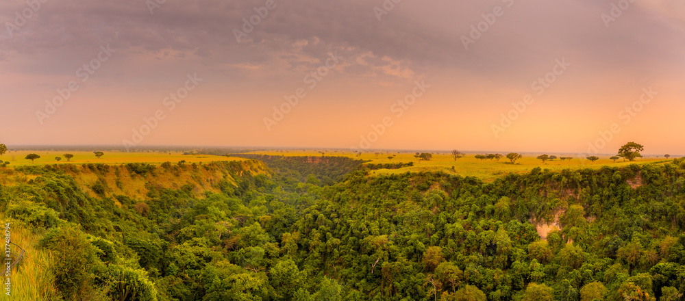 One kilometer long and 100 meters deep Kyambura Gorge in the Queen Elizabeth National Park at sunset that is a home for chimanzees, Uganda.	
