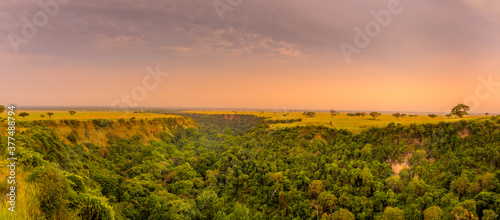 One kilometer long and 100 meters deep Kyambura Gorge in the Queen Elizabeth National Park at sunset that is a home for chimanzees  Uganda.  