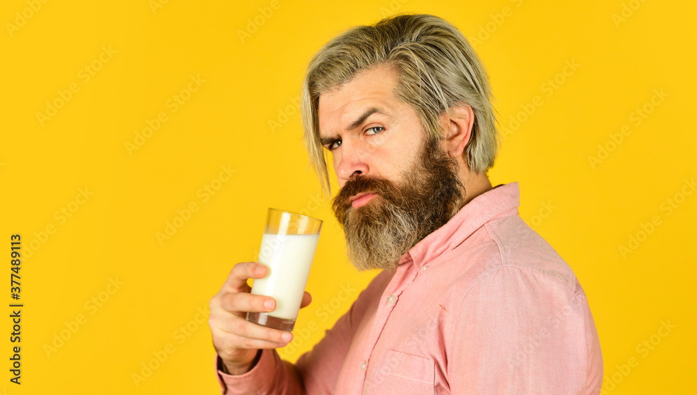 Milk for good health. Lactose free. Bearded man hold glass of milk. Vegan milk concept. Drink protein cocktail. Healthy habits. Almond milk is rich in several healthy nutrients. Source of calcium Milk for good health. Lactose free. Bearded man hold glass of milk. Vegan milk concept. Drink protein cocktail. Healthy habits. Almond milk is rich in several healthy nutrients. Source of calcium
