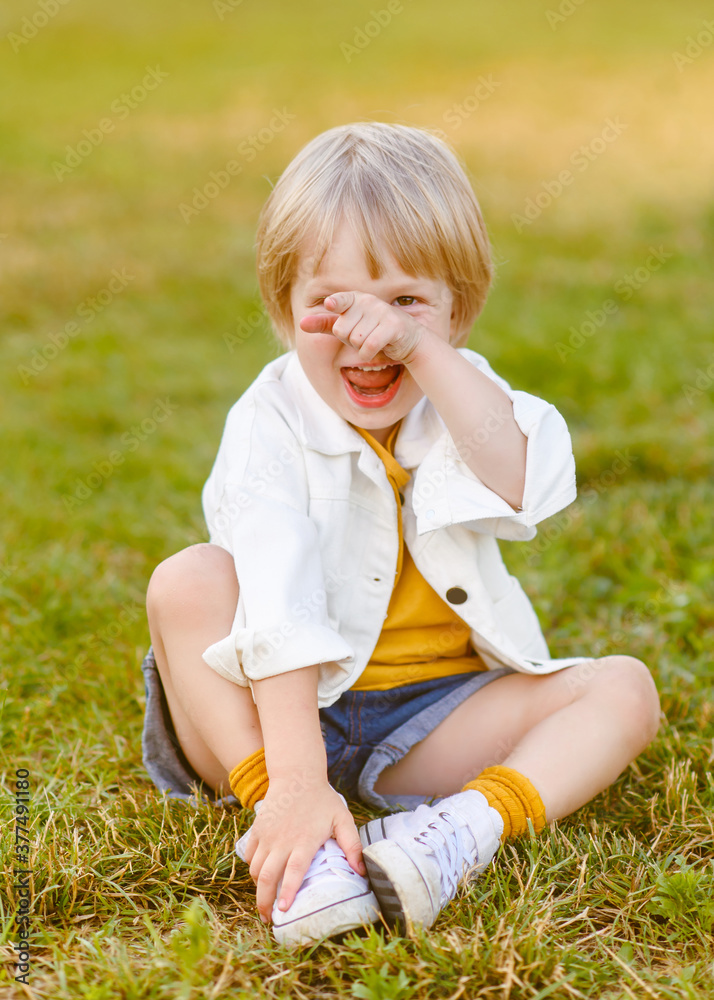 Fototapeta premium portrait of little model boy in nature