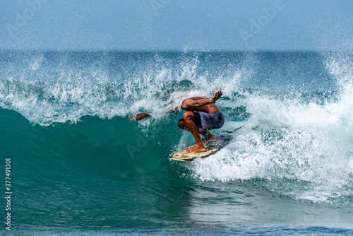 African surfer in a  pipeline
