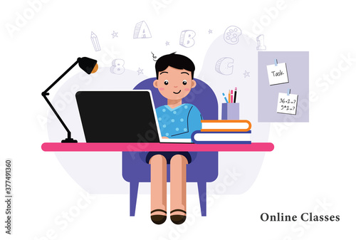 Boy is studying with laptop at home