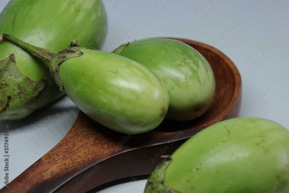 Fresh Raw Sliced green colour Eggplant Brinjal or Eggplant isolated on white background Fresh Raw Sliced green colour Eggplant Brinjal or Eggplant isolated on white background