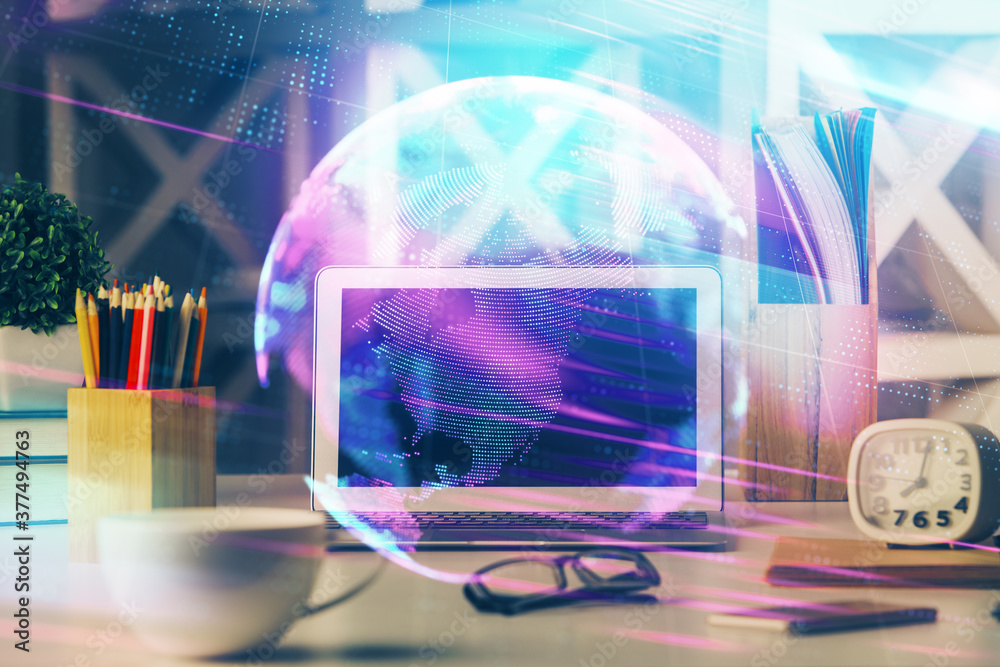 Computer on desktop in office with technology theme hologram. Double exposure. Tech concept. Computer on desktop in office with technology theme hologram. Double exposure. Tech concept.